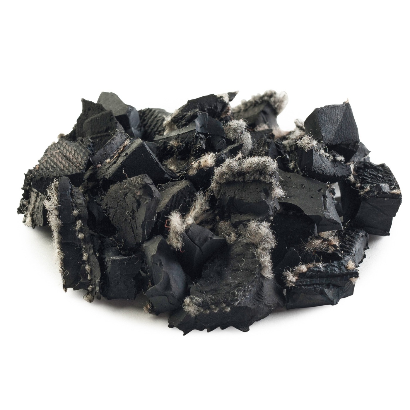 Unpainted rubber mulch, close view showing the natural rubber and fabric